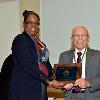 VP LeSans Alexander presents Anthony NeCastro with his DAHF medallion & plaque