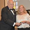 Susan Kimm Gentry receives Inductee Richard Kimm's DAHF medallion from DAHF President Bruce Lambrecht