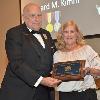 Susan Kimm Gentry receives Inductee Richard Kimm's DAHF plaque from DAHF President Bruce Lambrecht