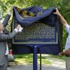 Tom Summers and Jim Hickin do the honors of the unveiling.
