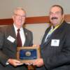  DAHF president Harry Van Den Heuvel presenting plaque to inductee Dave Cannavo.