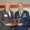 President Van Den Heuvel presenting inductee plaque to DANG Lt. Col. Jim Kohler. 