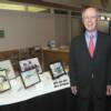 2009 DAHF selectee Brig.Gen (Ret) Jon Reynolds in front of his "inductee display" in reception area.
