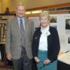 Colin Hunt, Holger Hoiriis' son-in-law, and another daughter of Hoiriis, Mrs. Karen Hasek, in front of the Hoiriis exhibit.
 