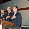 Paul Cathelll leads in the Pledge of Allegiance leader, joined by Master of Ceremonies Jim Kohler and Banquet Chairman Frank Ianni.