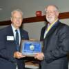 Inductee John Jordan receiving his plaque from DAHF President Hugh Horning.