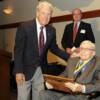 DAHF president Hugh Horning congratulating newly-inducted E.N. Tyndall, Col.,USAF (Ret) with wingman trustee Jim Hickin in background.