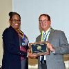 VP LeSans Alexander presents Robert McMahon with his DAHF medallion & plaque