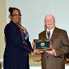 Kennard R. Wiggins, Jr., receives the DAHF medallion & plaque from VP LeSans Alexander on behalf of his father, Kennard Robert Wiggins.