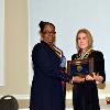 VP LeSans Alexander presents daughter Cindy Wilson-Risko with Robert S. Wilson's DAHF medallion & plaque