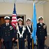 The Delaware Military Academy Color Guard awaits the start of the ceremony