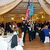 The Delaware Military Academy Color Guard enters the hall to start the ceremony