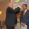 Inductee Jo'Andrew Cousins receives his DAHF medallion from DAHF President Bruce Lambrecht